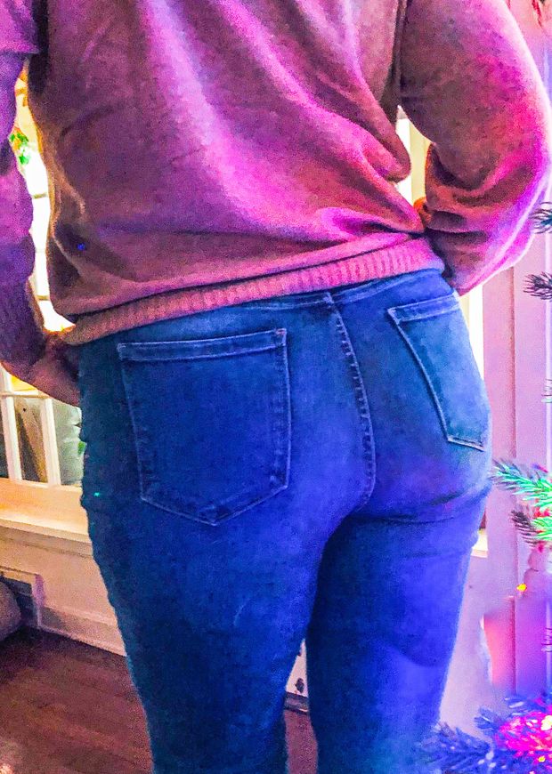 Unbuttoning to show that big ass
