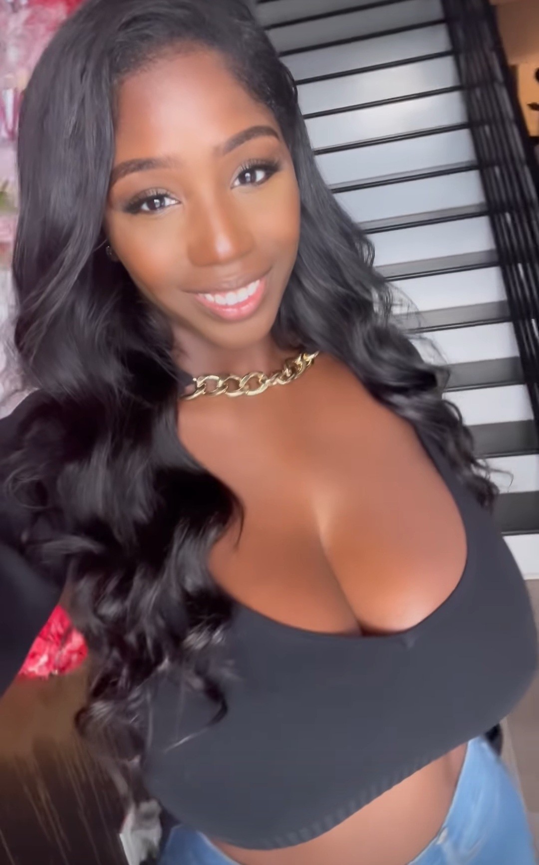 Ellie Mae black top selfie in front of stairs