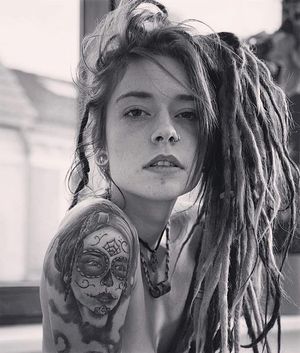 Sexy Hippie with dreads and tattoos