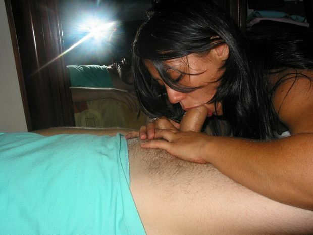 Amateur brunette slurping on some cock