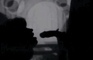 Blowjob behind the movie screen