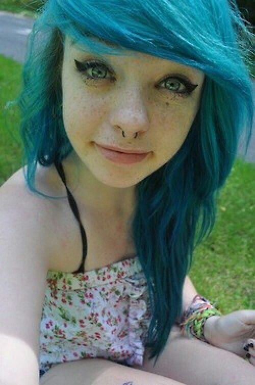 Blue hair lady looks like a goth.
