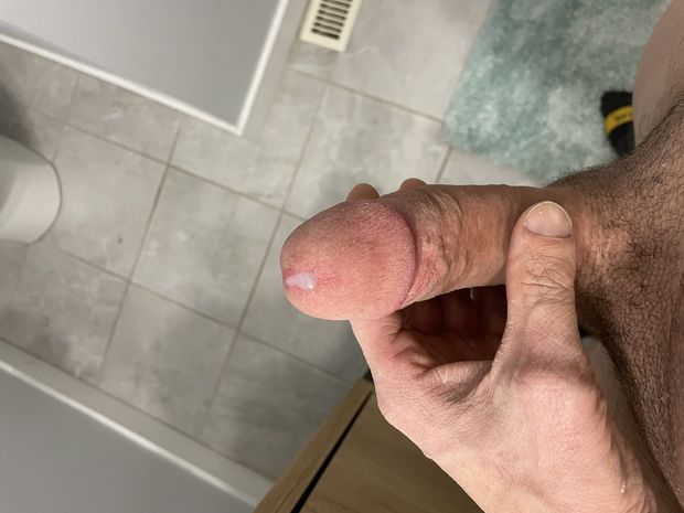 A drop of precum at the tip of my hard cock who wants a taste