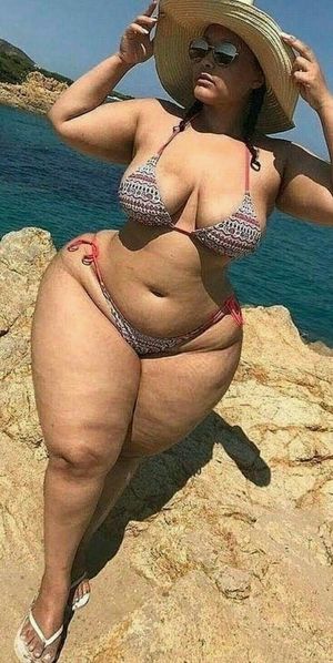 Amateur with wide hips on the beach
