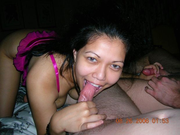 Amateur brunette with light eyes having her choice of two cocks to suck on