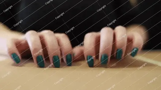 Tapping on the table.
