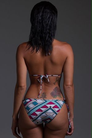 Draya Michele's thick sexy ass in blue, white, and red triangle pattern bikini and tattoos