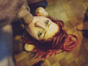 Amateur redhead with dreads trying to shove cock in her mouth