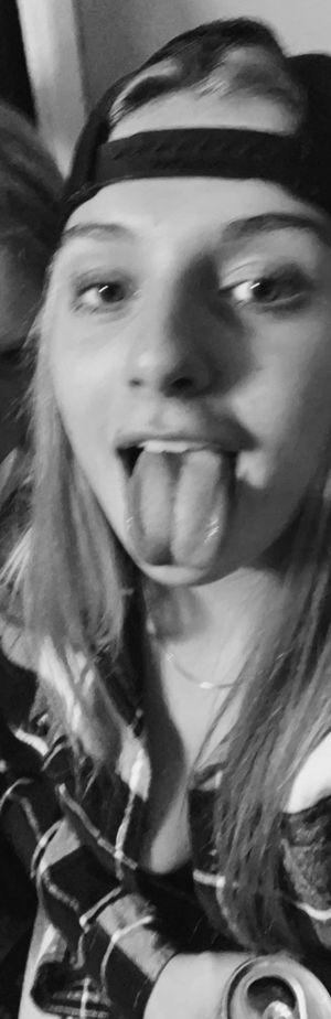 Keyra in ball cap with tongue out