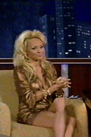 Adjusting her famous twins.