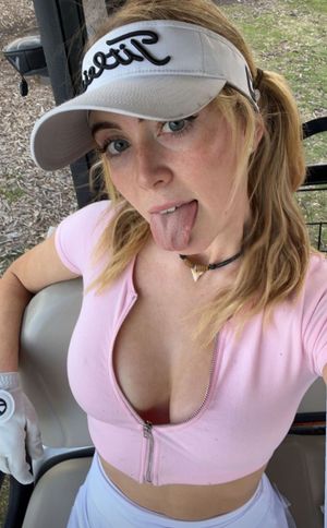 Grace pink top tongue out cleavage