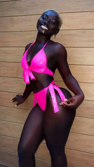 Black woman in pink Bikini