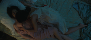 Asian lesbian teens laying in bed