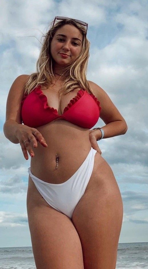 Jolie showing boobs in red and white bikini