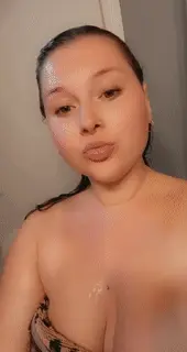 Licking her nipple