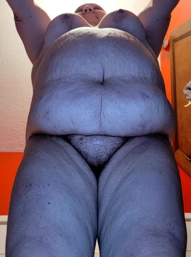 BBW nude bent over showing off her big beautiful belly, tits and pussy