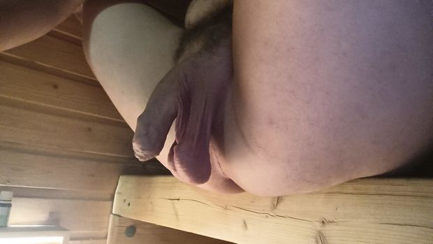 Guy hanging his balls low in sauna