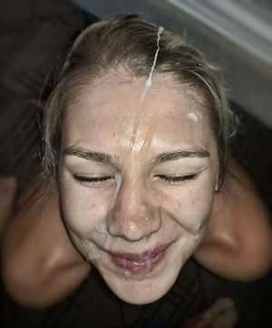 Happy amateur brunette with cum all over her face