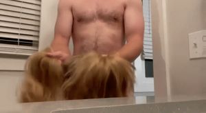 Pulling her pigtails