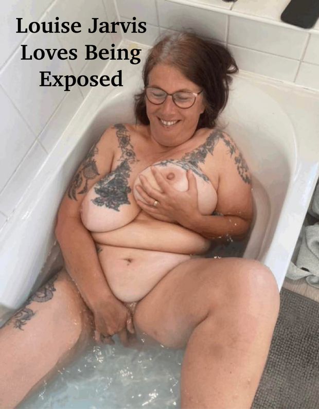 Louise plays with her pussy in the tub.