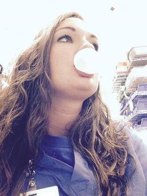 Sexy slut nurse in scrubs blowing gum wishing she was blowing a cock