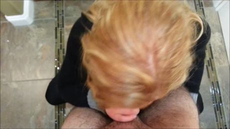 Redhead sucks cock in bathroom
