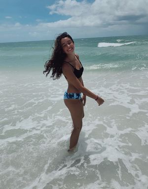 Sexy teenslut Hailey posing oceanside on the beach