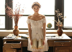 She only stops reading to ride her dildo