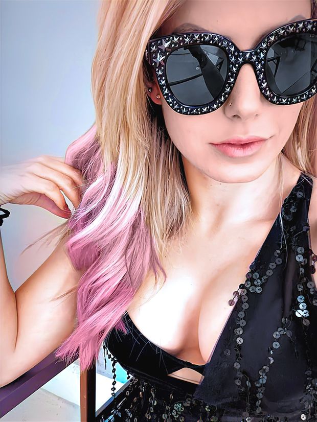 Petite and fit Alexa Bliss shows off her busty implant cleavage