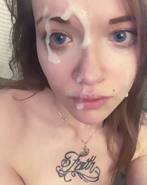 Pretty amateur teen with a tattoo and cum on her face