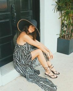 Sara Malakul Lane sitting on white step!