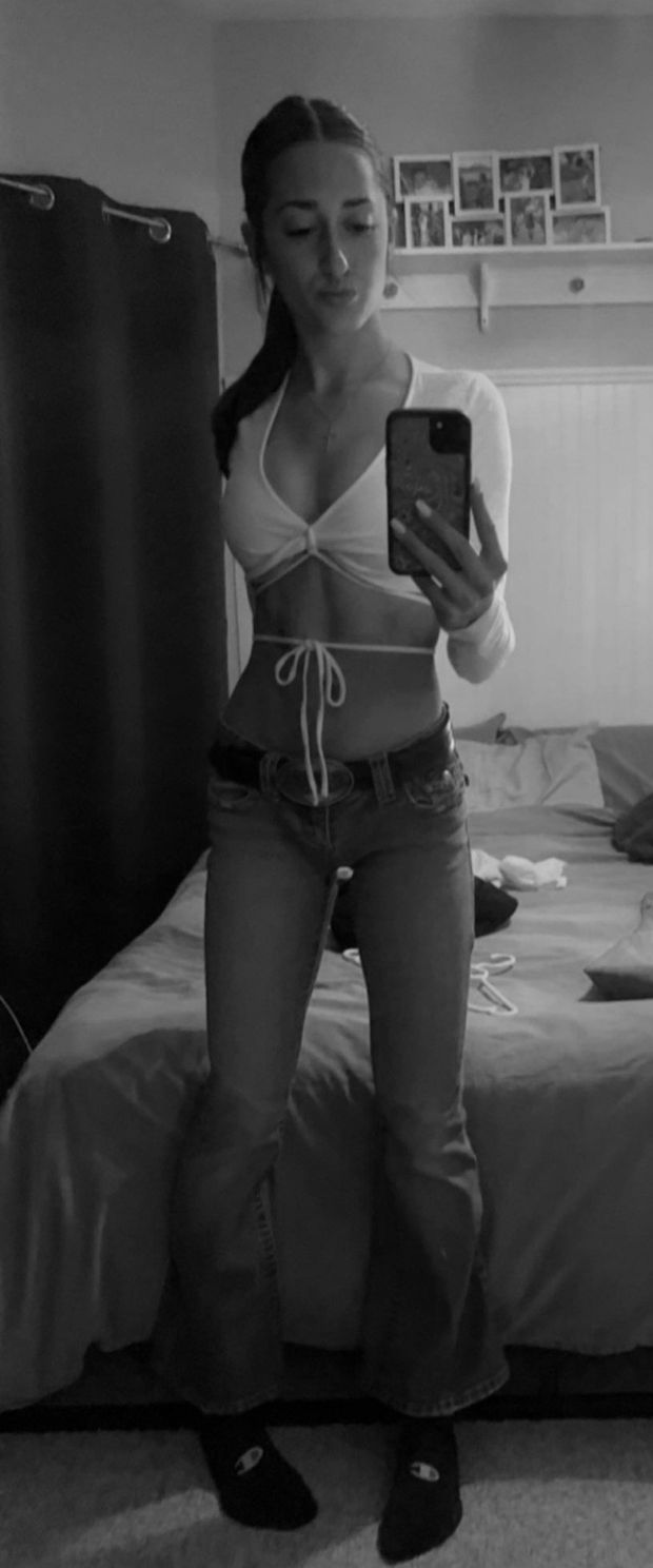 Teen in white top low rider jeans