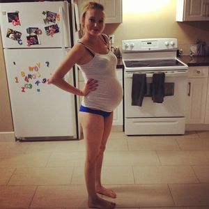 Barefoot and pregnant in the kitchen
