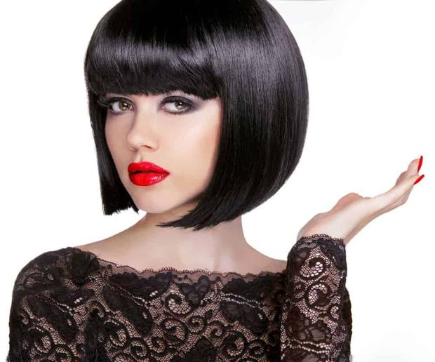 Unknown model in sexy black wig with dramatic makeup and expression