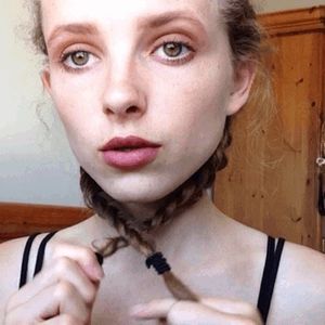 Chocking herself with her braids