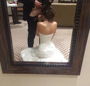 Lovely mirror-shot of a bride sucking on her husband's dick