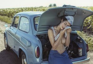 Fixing her own car. Impressive.