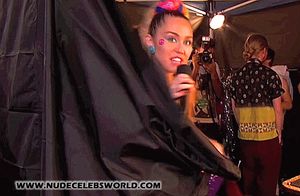Miley Cyrus Flashes A Tit Backstagy Gif