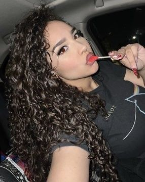 Demetria Obilor with a lollipop