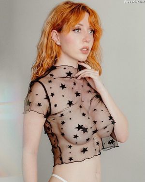 beautiful ginger in see through shirt