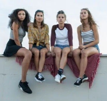Four Gen Z women, great legs