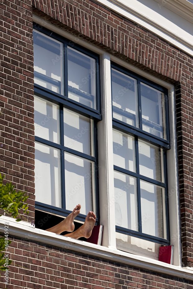 Bare feet out window
