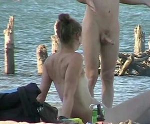 Sister looks at brother's dick on nude beach