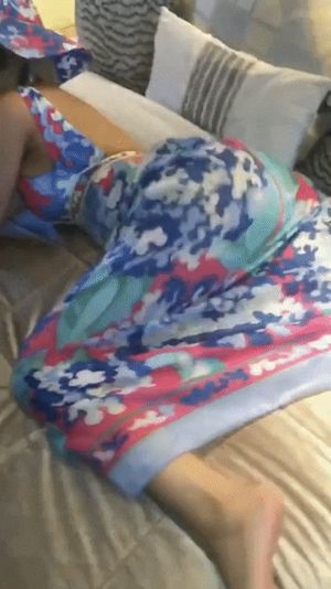 Cardi B twerking in a sundress