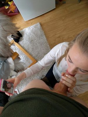 Brunette amateur taking a selfie of herself sucking dick