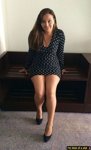 Smiling slutwife wears polkadots at the office.
