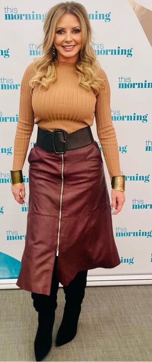 Carol huge boobs brown top and skirt