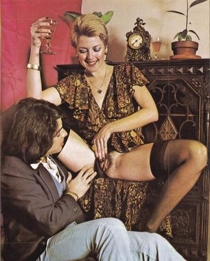 Juliette lifting her skirt and giving David Morris a good look at her beaver and cunt lips.