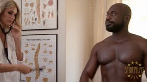 Doctor Emma Hix listening to Thrillmonger's heartbeat with her stethoscope.