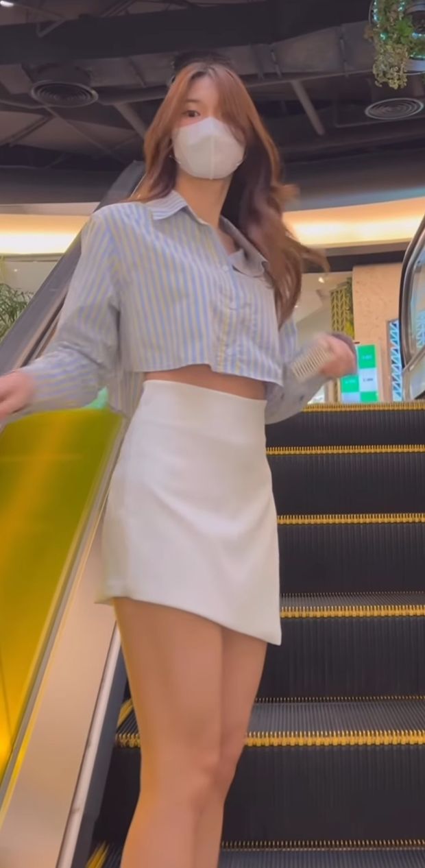 Beautiful asian whore on escalator